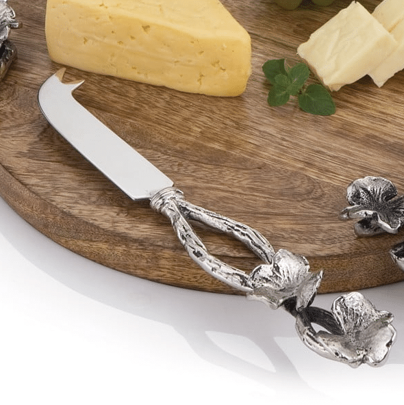 silver cheese knife with flower detail