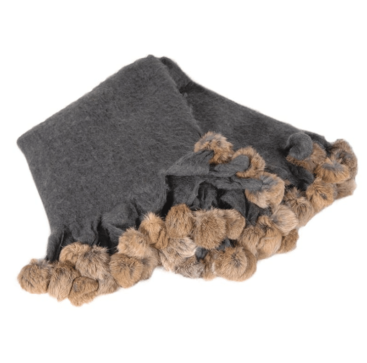 grey blanket with brown fur pompoms