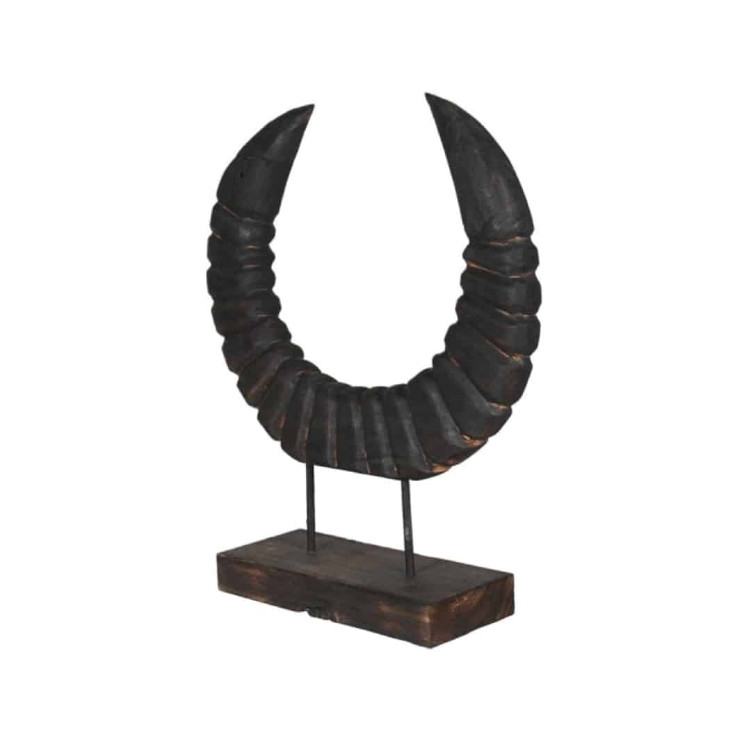 black horn sculpture on stand