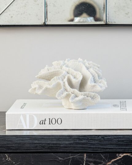 white faux coral ornament on a book