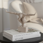 ivory crouching male sculpture on plinth