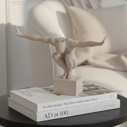 ivory crouching male sculpture on plinth