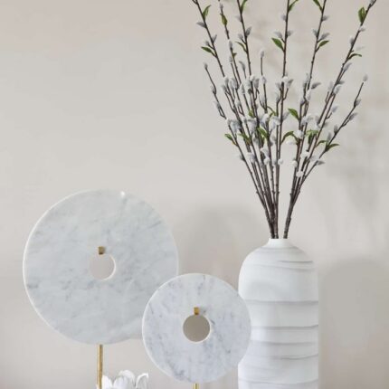 large round disc ornament on stand