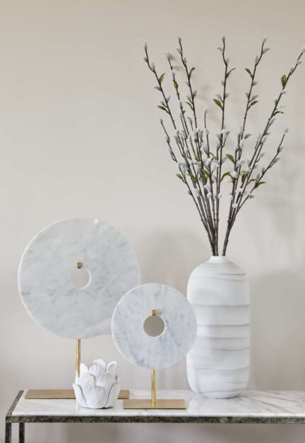 large round disc ornament on stand