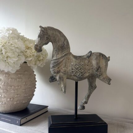rustic horse statue on stand side view