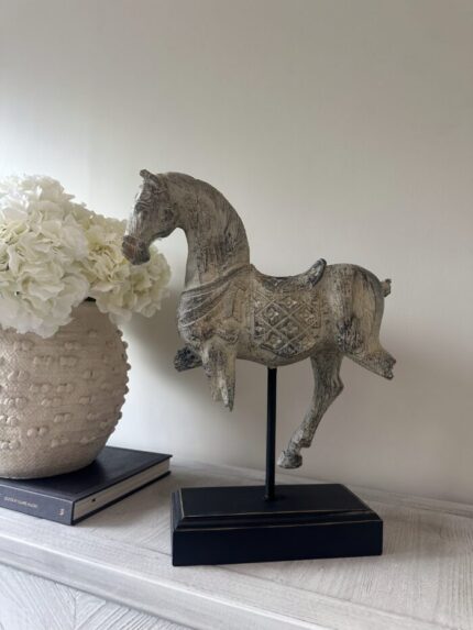 rustic horse statue on stand side view