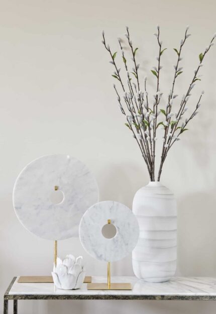 small circular disc ornament on golden stand