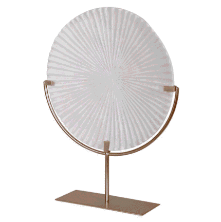 white circular disc sculpture on gold stand