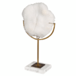 white faux coral sculpture on marble gold stand