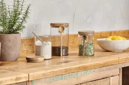 glass storage jar with wooden spoon and lid