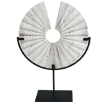 modern handmade travertine round disc sculpture on a black metal stand